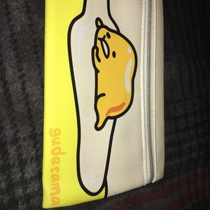 Mini makeup bag with an egg on it